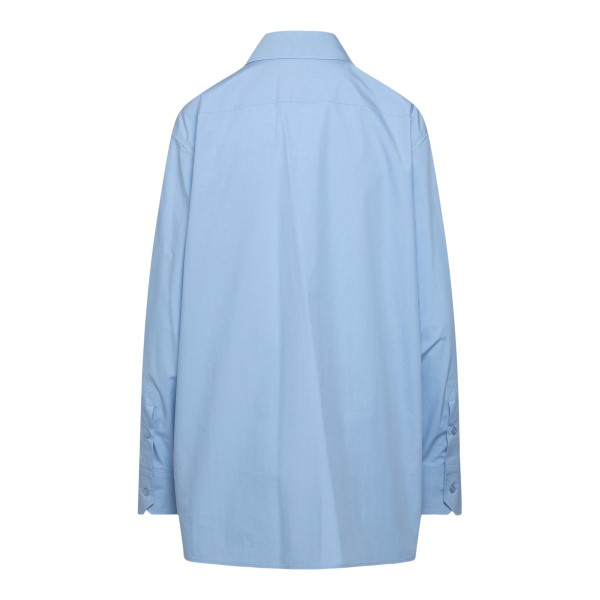 Camicia azzurra semitrasparente con ricami                                                                                                             davanti